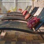 chaise lounge chairs by the outdoor pool