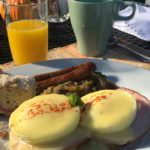Breakfast with Eggs Benedict, Link Sausage, Country Mash Beans, Cherry Coffee Cake