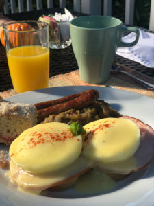 Breakfast with Eggs Benedict, Link Sausage, Country Mash Beans, Cherry Coffee Cake