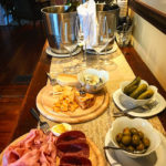 wine and cheese spread at happy hour